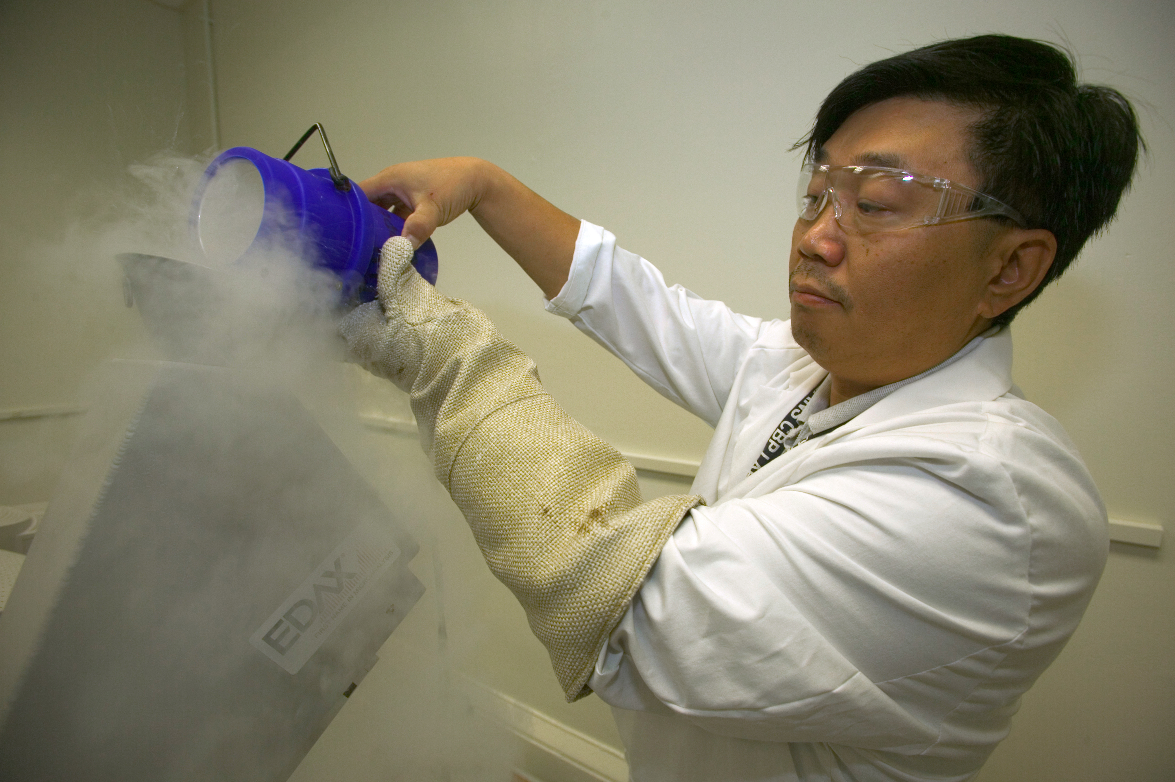 CBP Laboratory personnel use liquid nitrogen to supercool testing equipment.