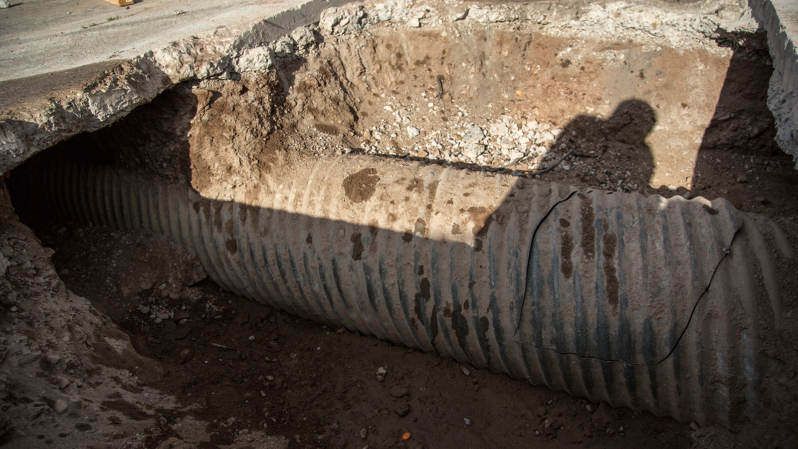 A rudimentary, hand-dug tunnel connected the diggers to the Nogales drainage system through a "break-in" which can be seen in this photograph.