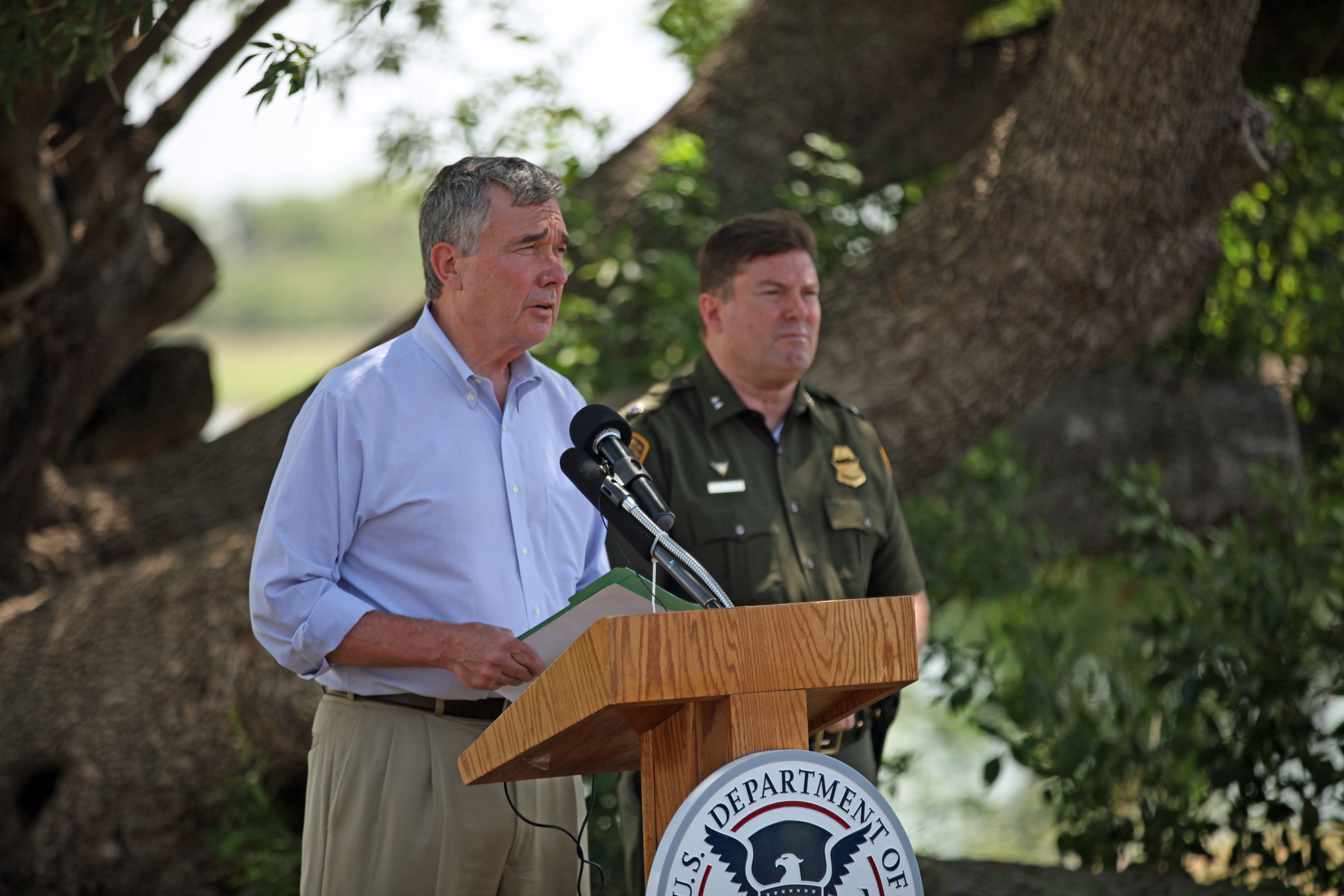 CBP Commissioner R. Gil Kerlikowske discussing the dangers and misinformation associated with the current influx of children attempting to enter the U.S. during a news conference on the banks of the Rio Grande River in Texas.
