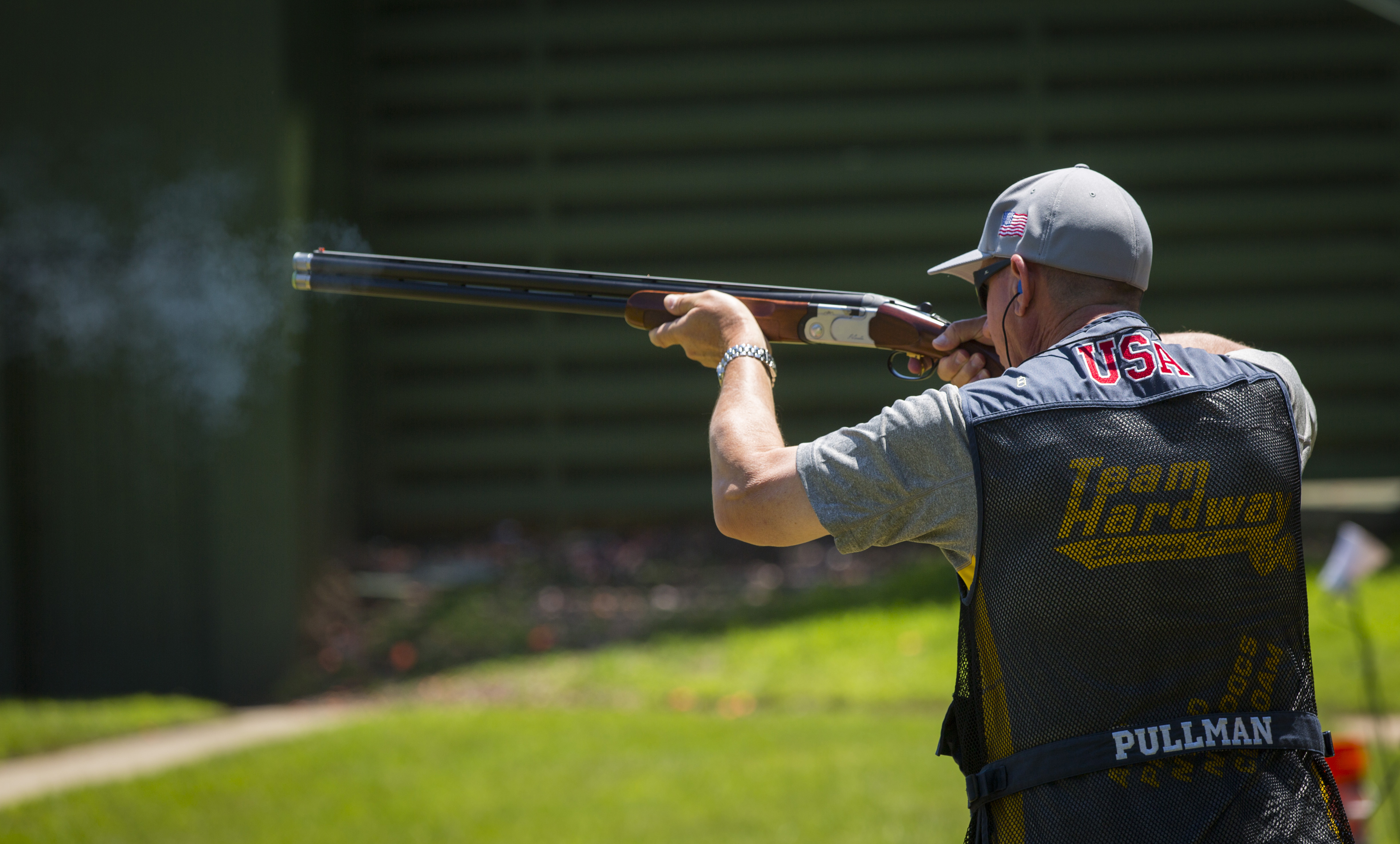 Michael Pullman, a CBP supervisory air interdiction agent, fires his Beretta shotgun in the trap shooting contest at the 2015 World Police & Fire Games, Centreville, Virginia. Photo by James Tourtellotte