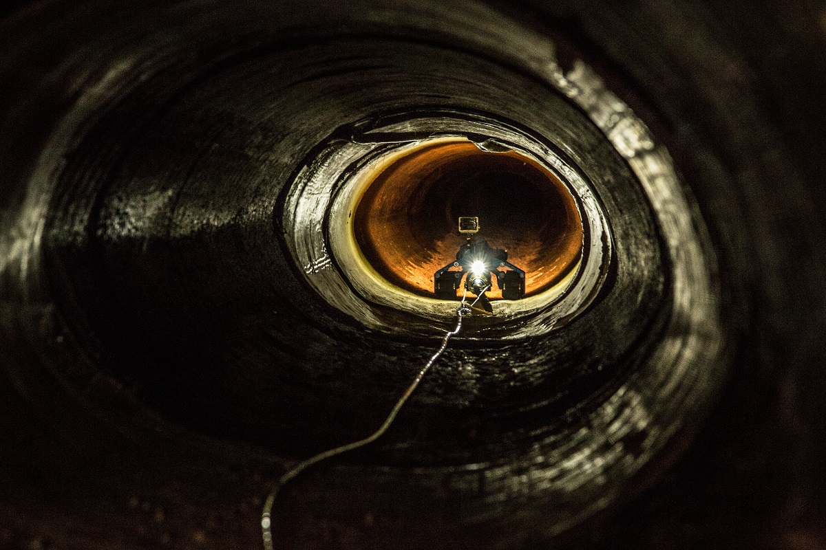 An unmanned robot with camera makes its way through drainage piping near Nogales, Ariz. (photo by Josh Denmark)