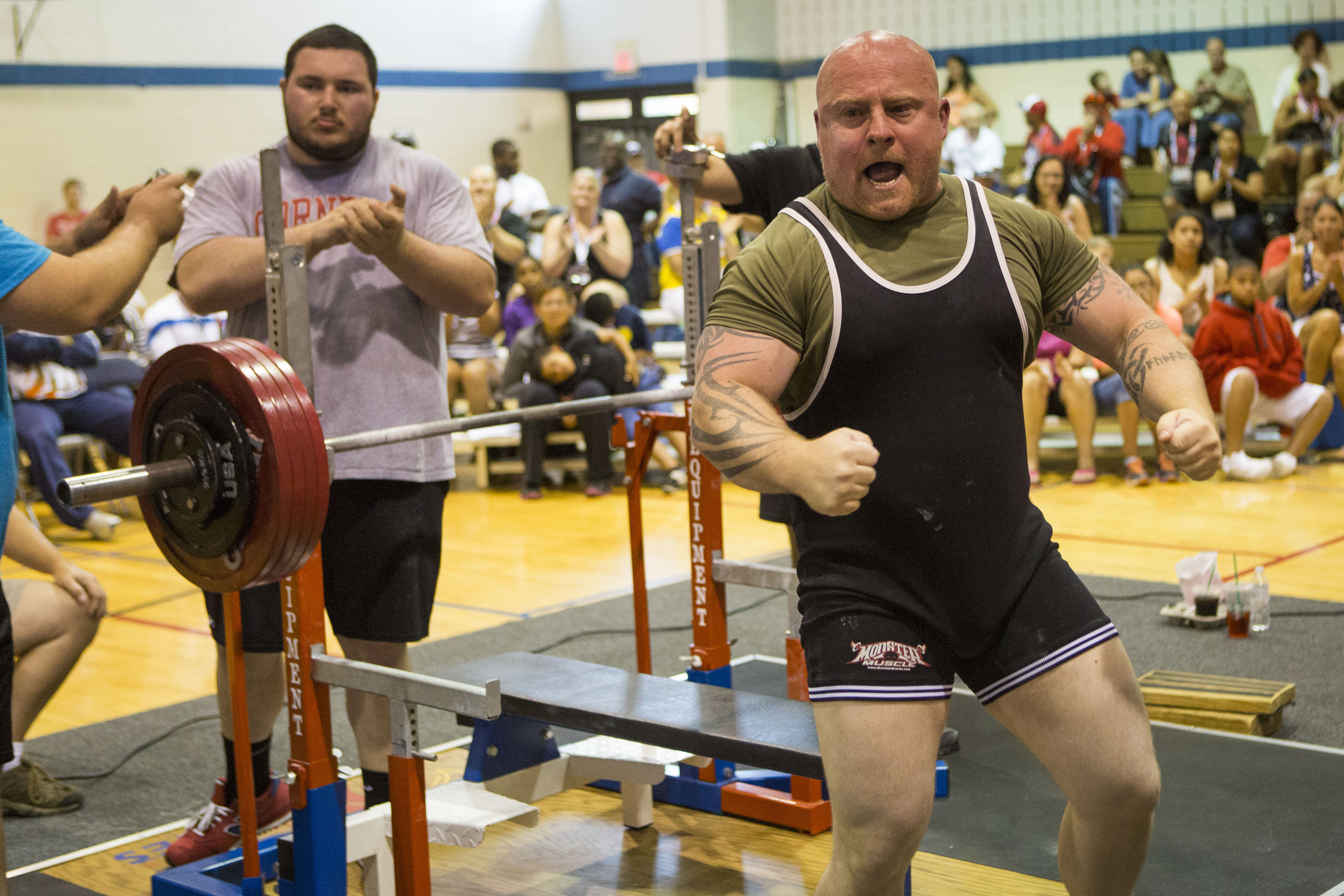 An exuberant Matt Phelps sets a 2015 World Police & Fire Games bench press world record. The Bonners Ferry, Idaho, Border Patrol agent reached his goal and his dream, lifting a remarkable 551 pounds. Photo by James Tourtellotte 