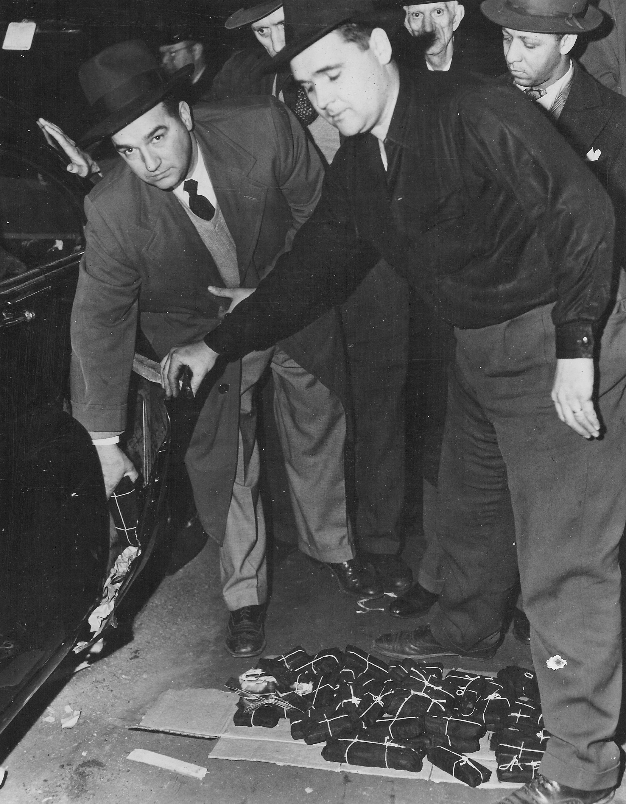 New York Customs officers removing gold bars found concealed in the fender of Saul Chabot&#039;s vehicle. (CBP historical collections, 1951)