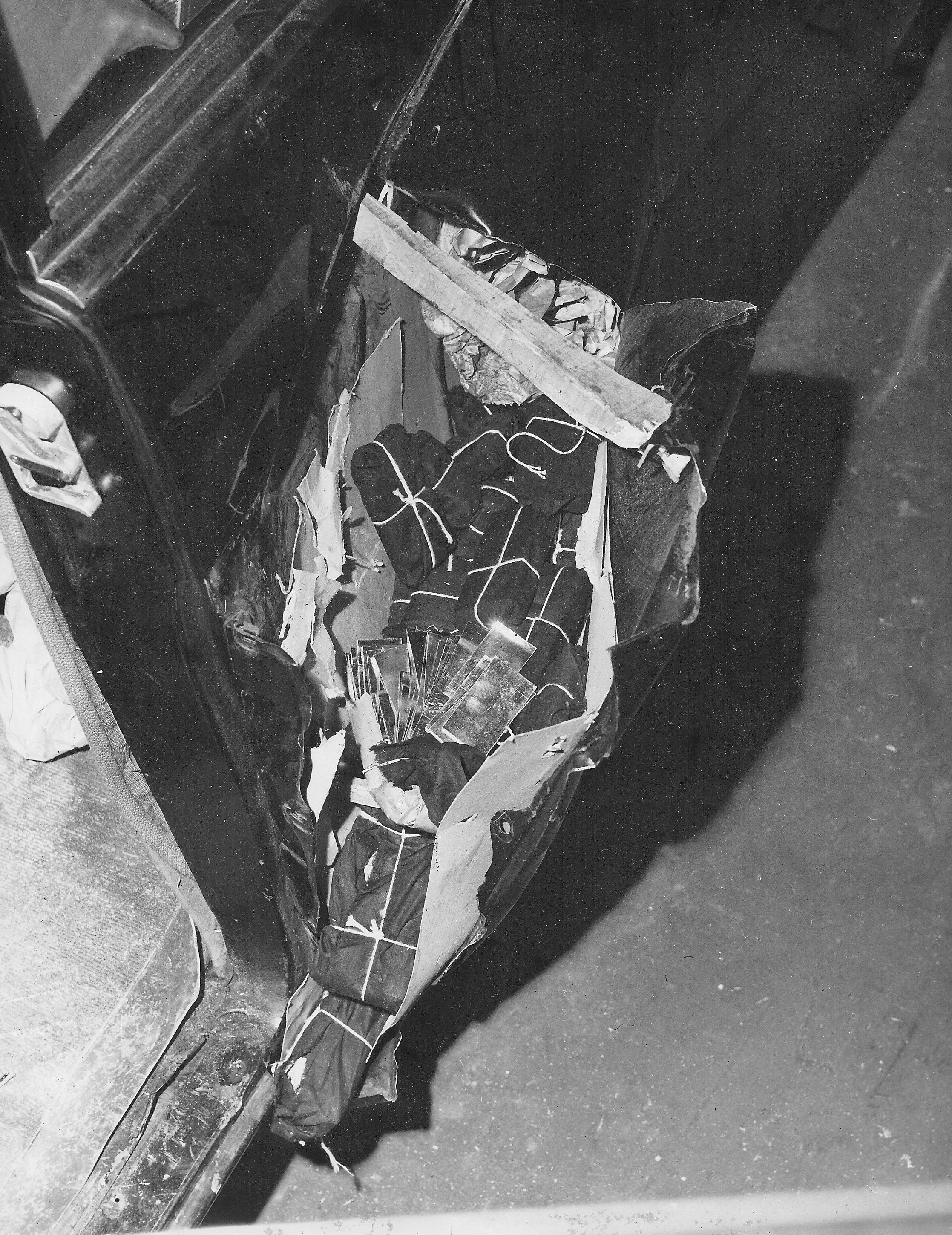 Fender compartment concealing 270 pounds of gold bullion wrapped in small packages. (CBP historical collections, 1951)