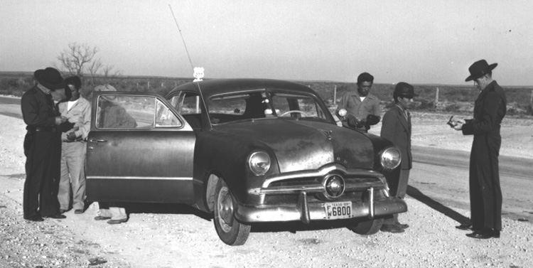 Traffic Check on Highway 277 north of Del Rio in late 1950s. [1955 plate on car]