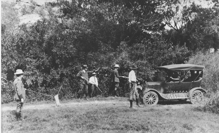 Del Rio Border Patrol Inspectors on road block near Del Rio, Texas in 1925. Patrol Inspectors include (left to right) Home E. Watkins, D.L. Kight, Loy C. Henry, Wesley Stiles, and F.L. Centilli.
