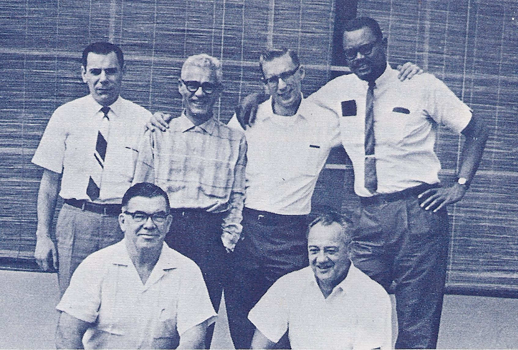 USAID/Customs men at a reunion. Front row: George Roberts, Saigon; Arthur E. Ouellette, Laos. Back row: Walter J. Pardaen, Senior Customs Representative, Paris-on special assignment in Saigon; William Shaw, James Foster and Ernest Bennet, all Laos. (Customs Today, May 1966)