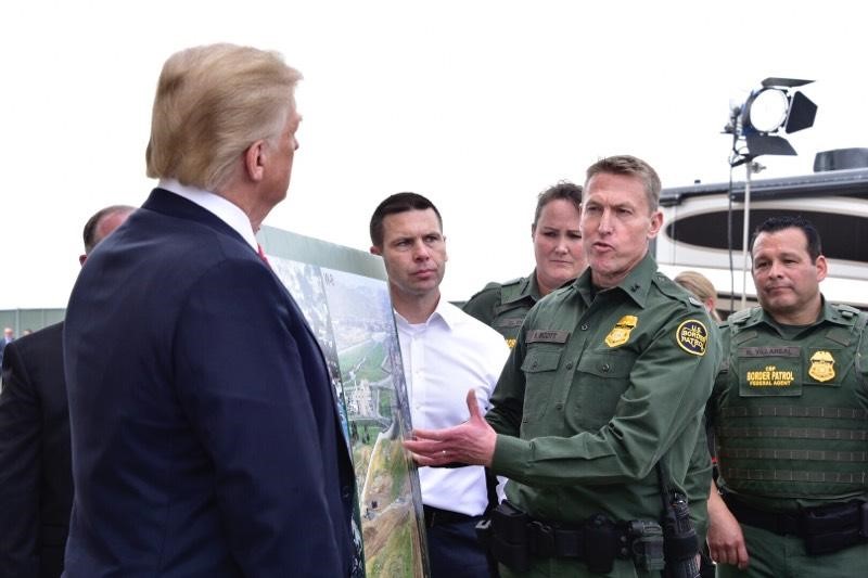 President Trump discusses border security with San Diego Border Patrol Sector Chief Patrol Agent Rodney Scott during a visit to the border wall prototypes and mockups Photo by Jetta Disco