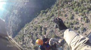 CBP personnel hoist an injured migrant from atop the Baboquivari Mountains
