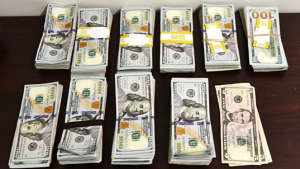 Stacks containing $100,019 in unreported currency seized by CBP officers at Laredo Port of Entry.