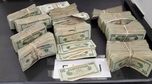 Stacks containing $119,880 in unreported currency seized by CBP officers at Eagle Pass Port of Entry.