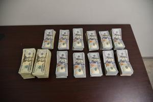 Stacks containing $125,306 in unreported U.S. currency seized by CBP officers at Laredo Port of Entry.