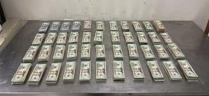 Stacks of bills containing $126,000 in unreported currency seized by CBP officers at Hidalgo International Bridge during an outbound examination.