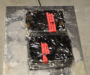 Packages containing 13.5 pounds of heroin seized by CBP officers at Laredo Port of Entry.