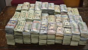 Stacks containing $931,739 in unreported currency seized by CBP officers at Brownsville Port of Entry.