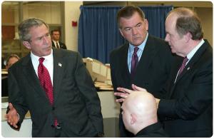 Former President George W. Bush and Secretary of Homeland Security Tom Ridge listen to CBP Commissioner Robert Bonner.