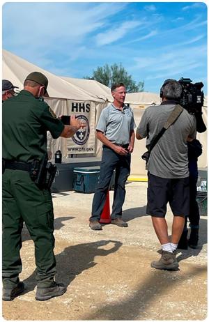CBP Chief Medical Officer Dr. Tarantino, center, is interviewed by CNN, during the Haitian Migrant Surge in Del Rio, Texas, in September 2021.