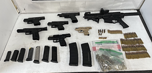 Seven weapons, nine magazines and 104 rounds of ammunition on a table were seized by CBP officers at Del Rio Port of Entry during an outbound examination.