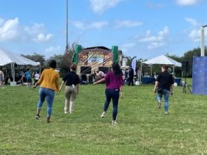 CBP employees and their family members line dancing to the music at the family outreach event in Miami on January 27, 2024.