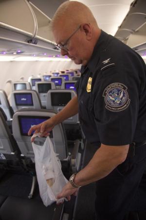 A CBP supervisory agriculture specialist finds a sandwich left behind by a passenger on a flight.