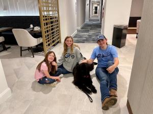 Rudd children with Izzy, CBP’s Support K-9 dog 