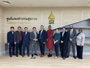 Eric Choy standing for a photo with other government officials and industry members in Thailand.