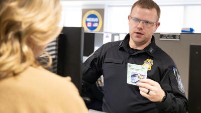 CBP officer interacts with trusted traveler program participant