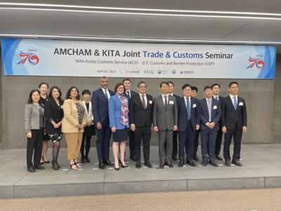 Image of the CBP and Korean customs officials posing as a group in front of a banner that reads AMCHAM & KITA Joint Trade & Customs Seminar with Korea Customs Service (KCS) and U.S. Customs and Border Protection (CBP) April 24, 2023