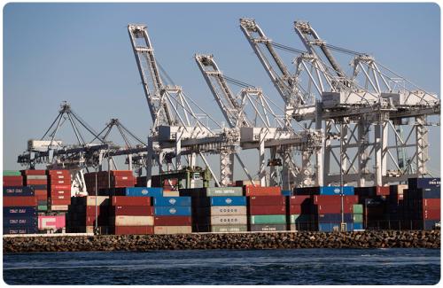 Containers stand stacked in the Port of Long Beach, California.