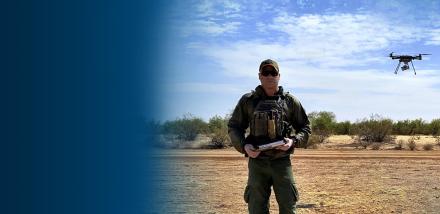Border Patrol Agent Zach Pruett operates a small, unmanned aerial system.