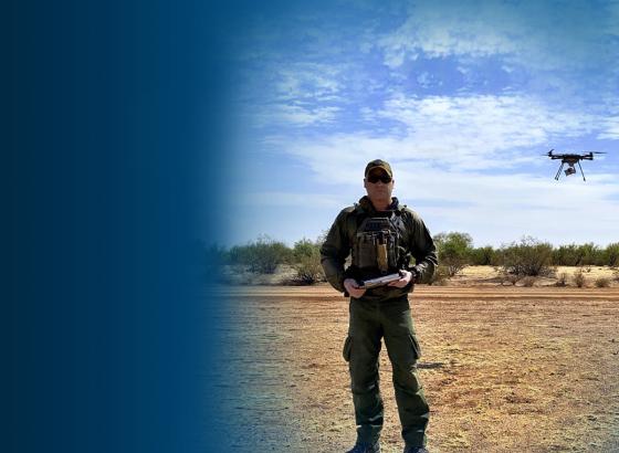 Border Patrol Agent Zach Pruett operates a small, unmanned aerial system.