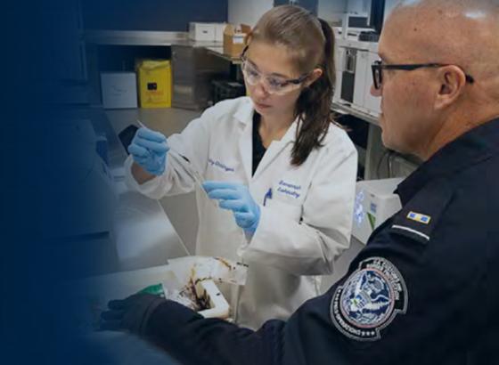 CBP scientist and OFO officer in a lab