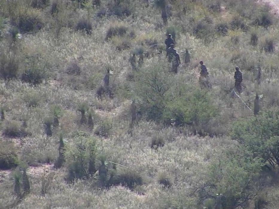 Five illegal aliens crossing the border