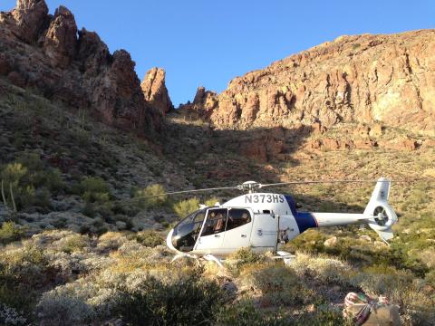 An Air and Marine Operations EC120 crew lands in the desert to retrieve bundles of marijuana near Yuma, Arizona.