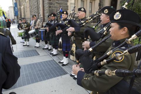 U.S. Customs and Border Protection Pipes and Drum Honor Guard members perform outside ceremony to honor fallen police and fire personnel, part of the 20th Annual Blue Mass in Washington, D.C.…