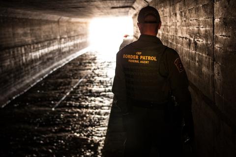 Border Patrol agent inspects a water drainage tunnel that spans from Nogales, Ariz. into Mexcio. (photo by Josh Denmark)