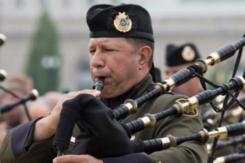 CBP member of the honor guard plays the bagpipes