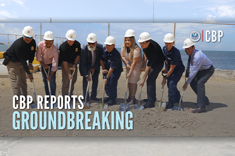 CBP Staff shovel dirt to signify the start of groundbreaking on new hanger.