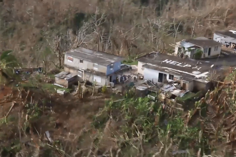 Shoot of house with help written on roof in PR