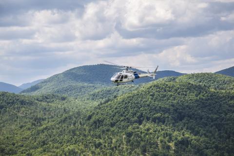 An AS350 crew assists in the hunt for escaped prisoners Richard Matt and David Sweat in upstate New York.