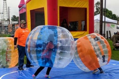 Children playing a friendly game of bubble ball