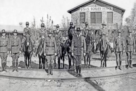 U.S. Immigration Service Border Patrol inspectors in formation in front of the Border Patrol's first training facility