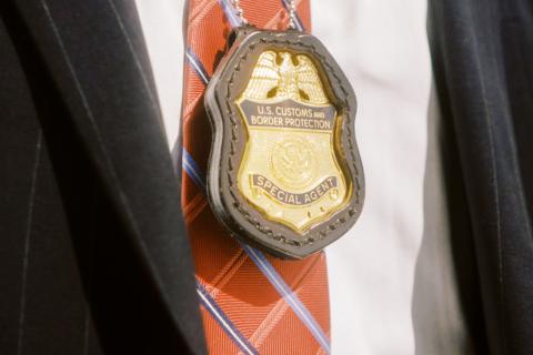 Badge hanging on the neck of an OPR Special Agent