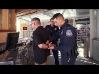 CBP officer places suspect in custody