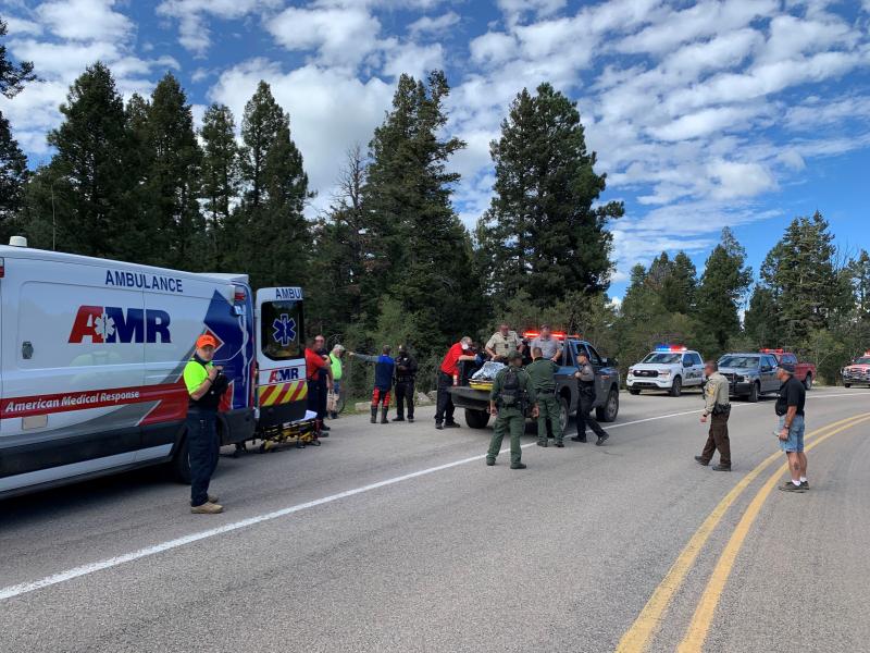 Border Patrol Agents and EMS aid injured mountain bike near Alamogordo, New Mexico