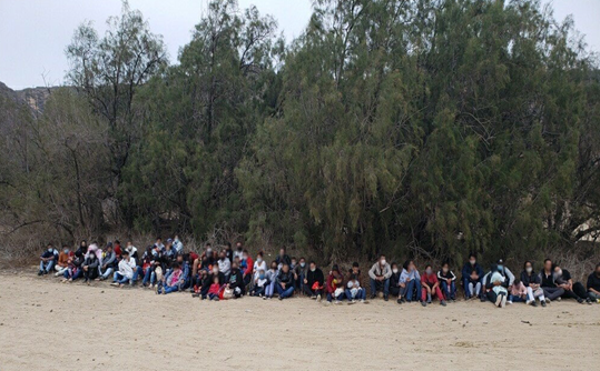 A group of 74 men, women, and children from Brazil and Venezuela.