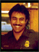 Norman Salinas smiling in photo.