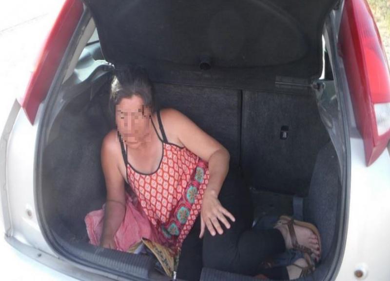 Woman hiding in trunk 