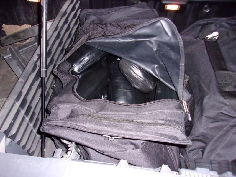 CBP officers removed 64 cellophane-wrapped packages from inside the bags; 59 of the packages contained methamphetamine and five contained fentanyl.