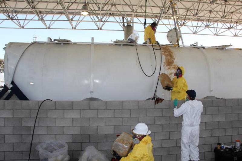 CBP officers, with the help of the local and state hazardous materials experts, remove the lead oxide from the tanker first.